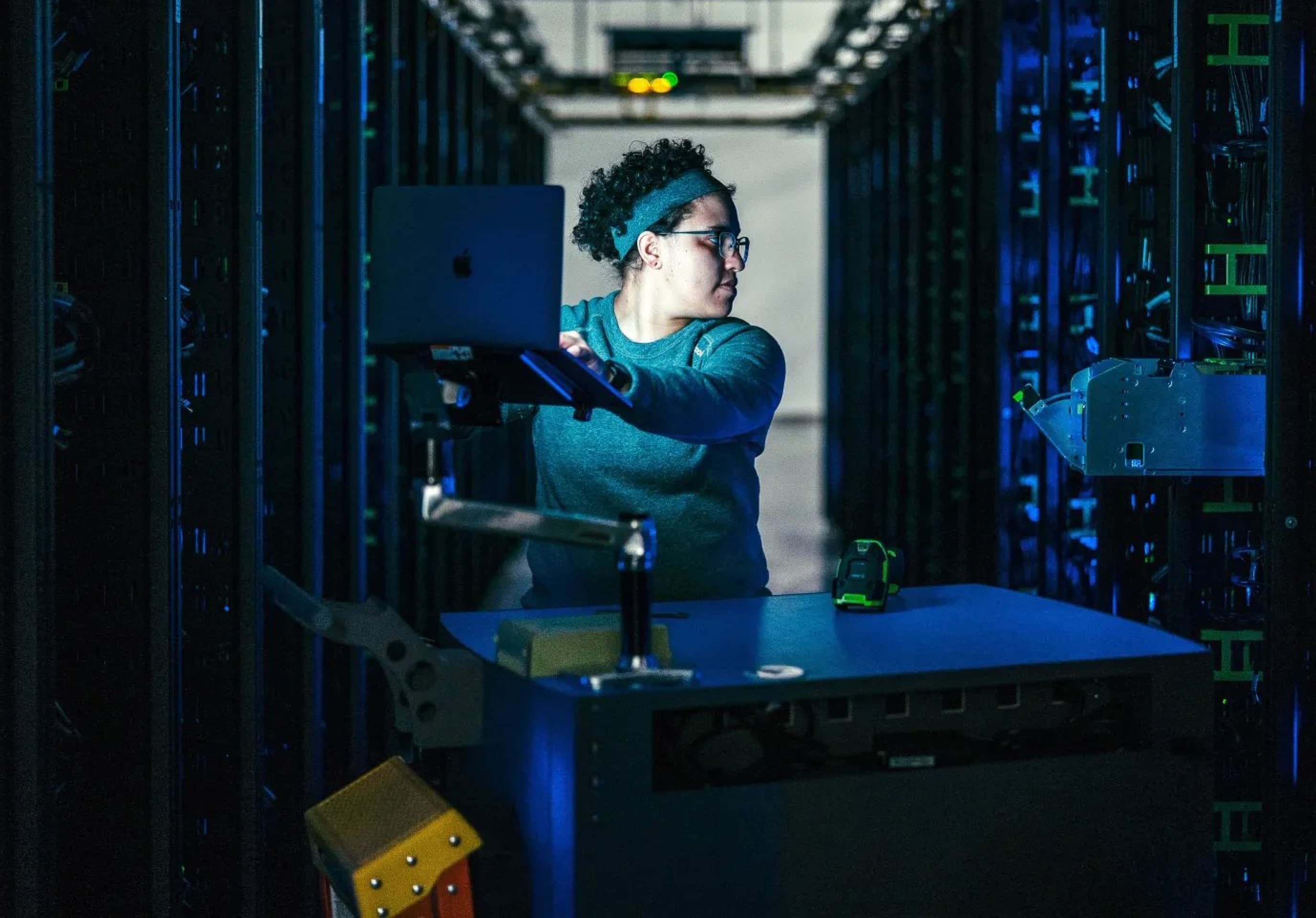 Data center technician working in a server room